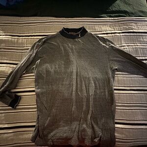 PGA tour blue turtle neck.